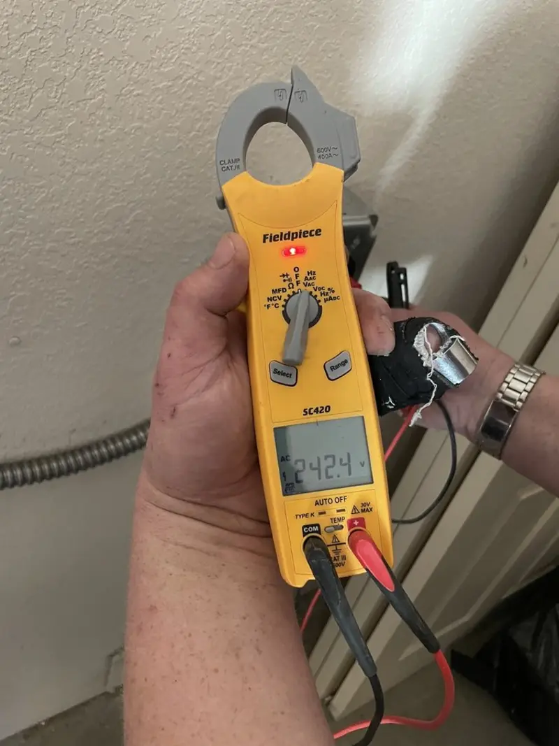 Voltage testing with clamp meter during Recessed Lighting Installation in Broken Bow